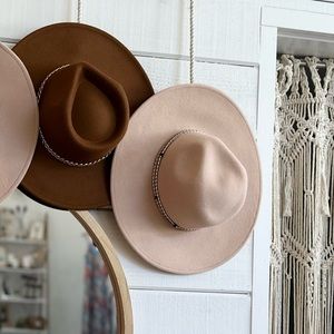 Beige wool Panama style hat, with tan tied string. Thicker wool hat material.